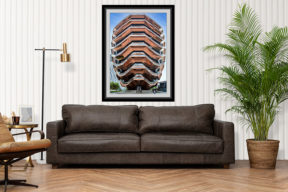 The Vessel image framed and hanging o ver sofa lounge area