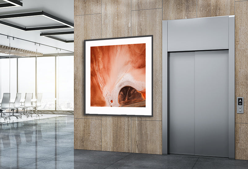 Large aerial print of earth patterns in office lobby
