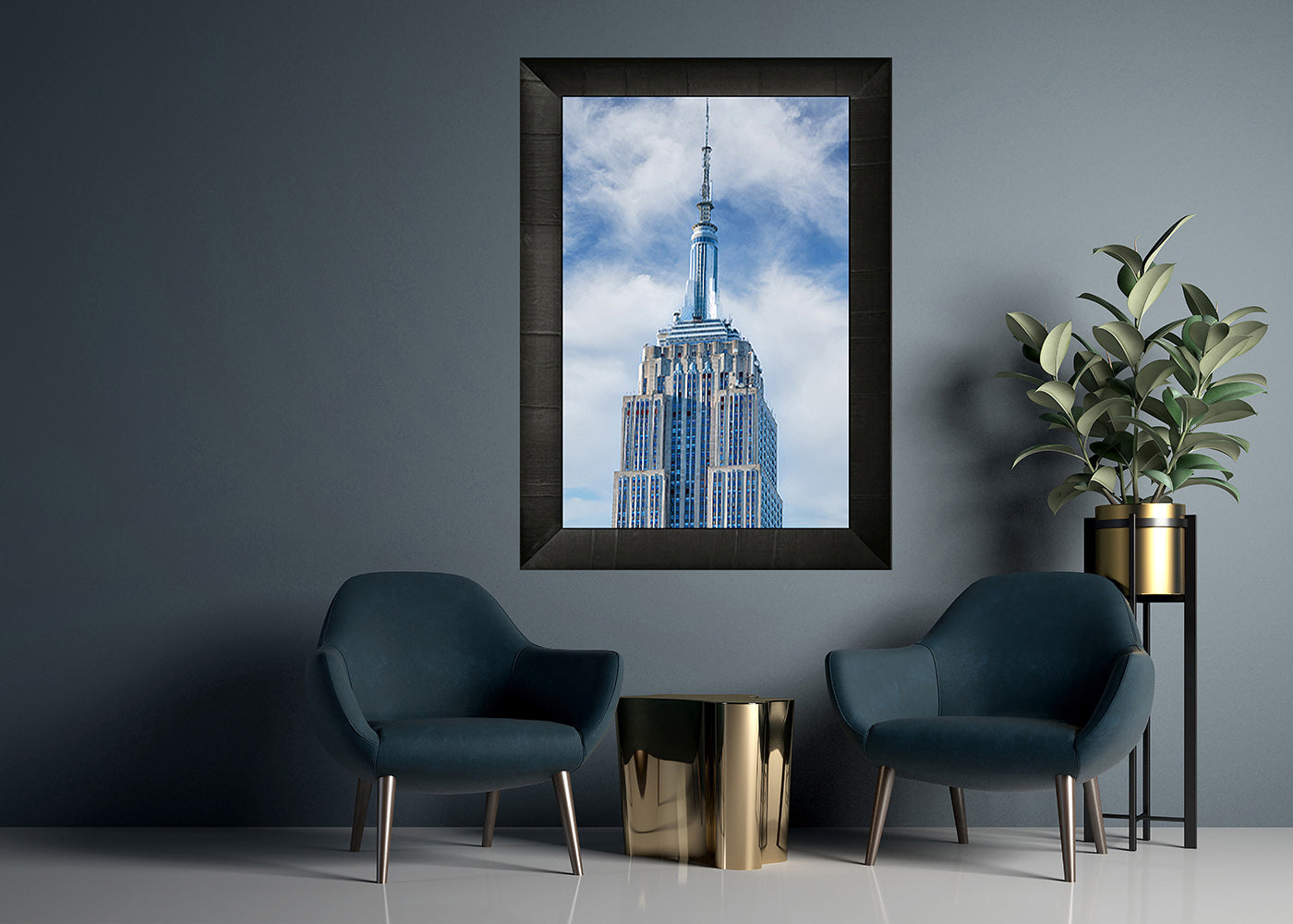 Print of The Empire State Building in black wooden frame on wall