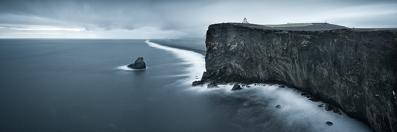 Cape Dyrholaey lighthouse with storms clouds approaching