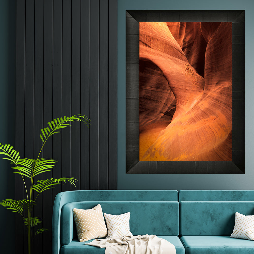 framed print of inside antelope canyon hanging above sitting chair
