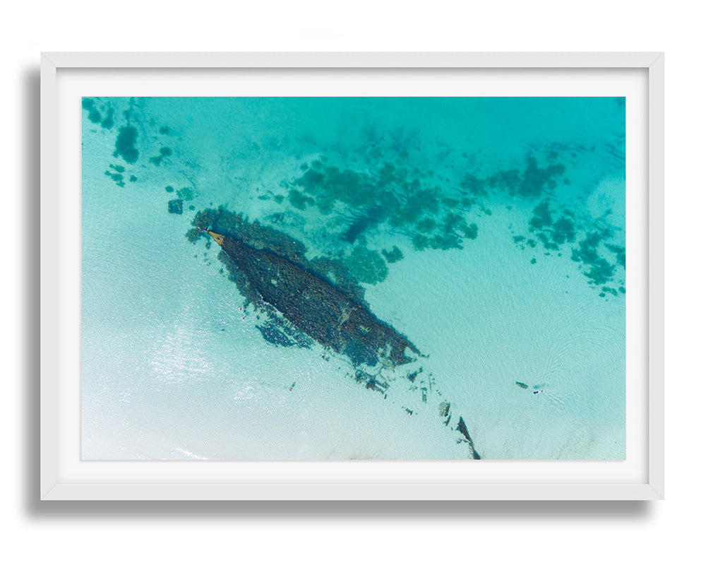 White framed print of the Omeo ship wreck taken from above by drone