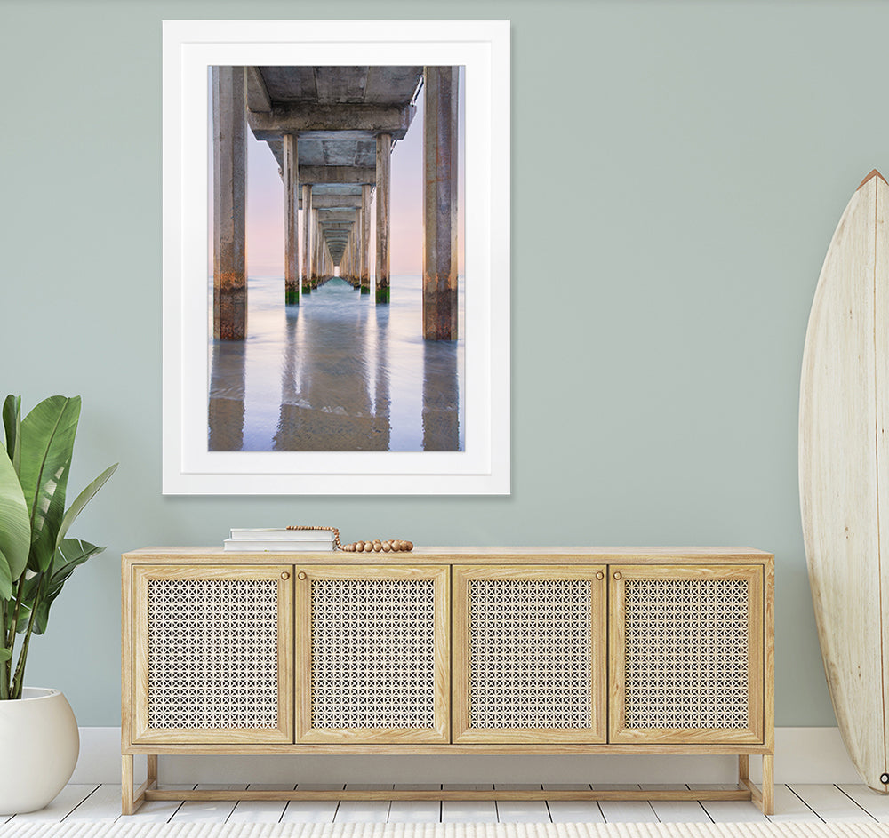 Framed print of Scripps Pier hanging in casual beach home