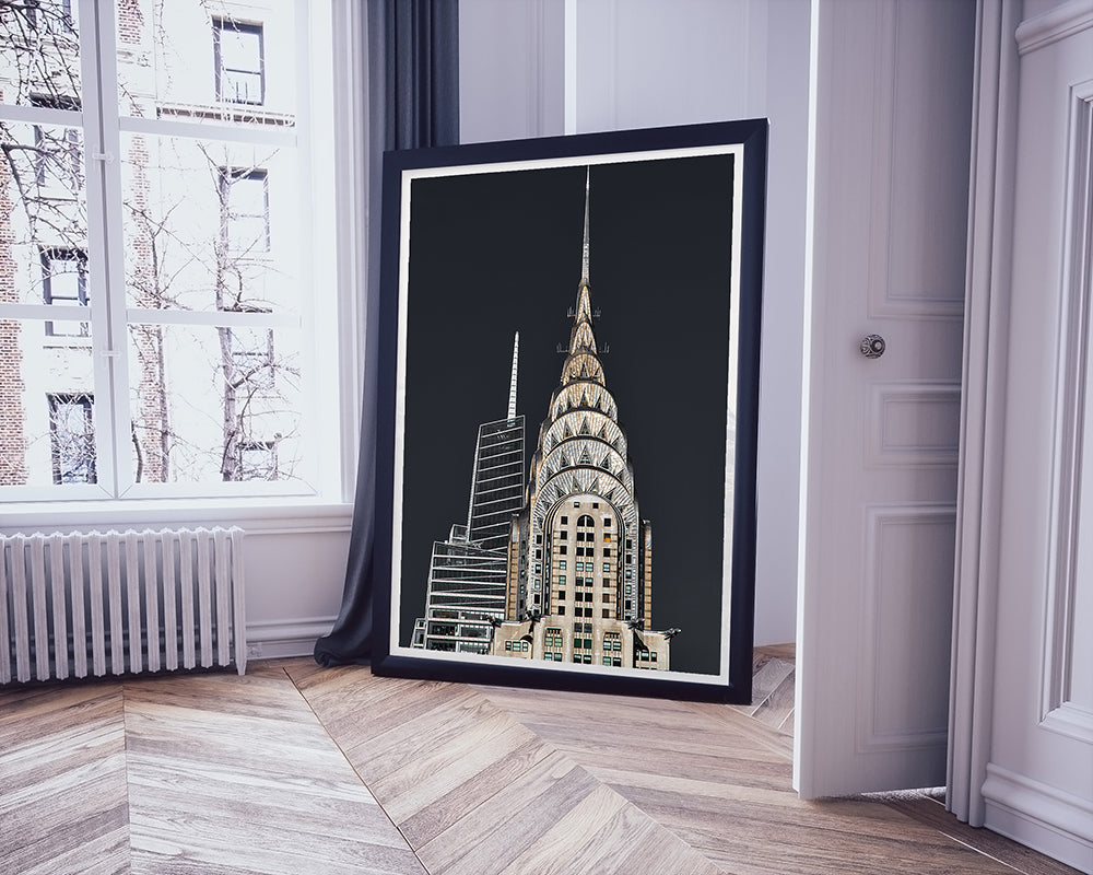 Framed print of the Chrysler Building resting against apartment wall