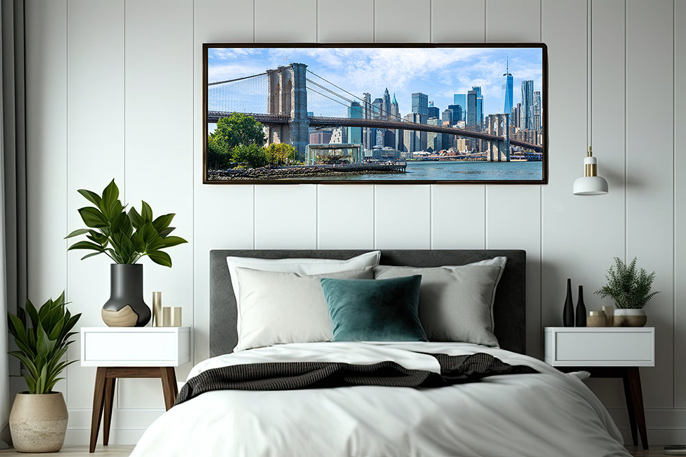 Framed image of the brooklyn bridge over double bed