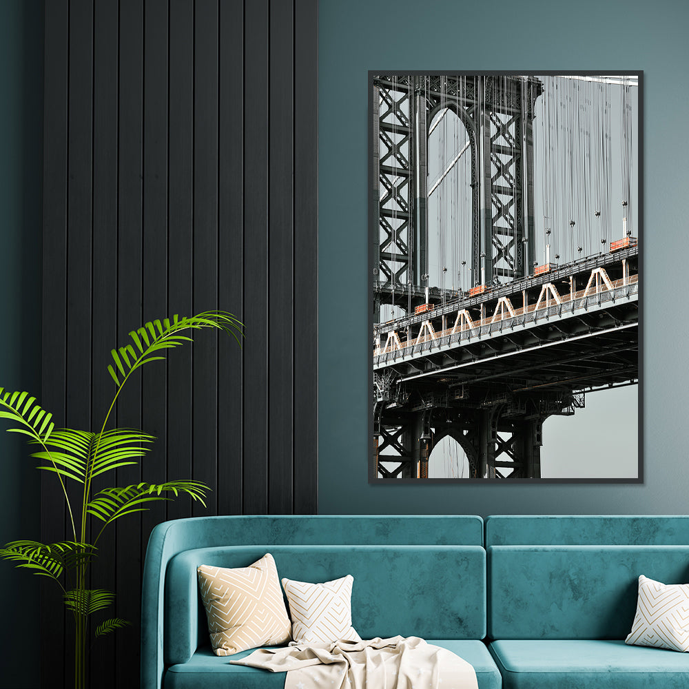 print of manhattan bridge hanging in a sitting room 