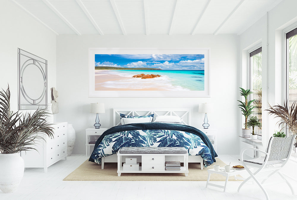 Large panoramic framed print of bunker bay beach hanging in beach house bedroom