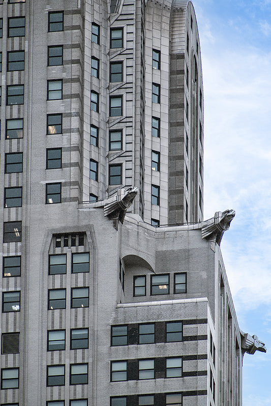 A close up image of the eagle heads sculptures near the top of the Chrysler building